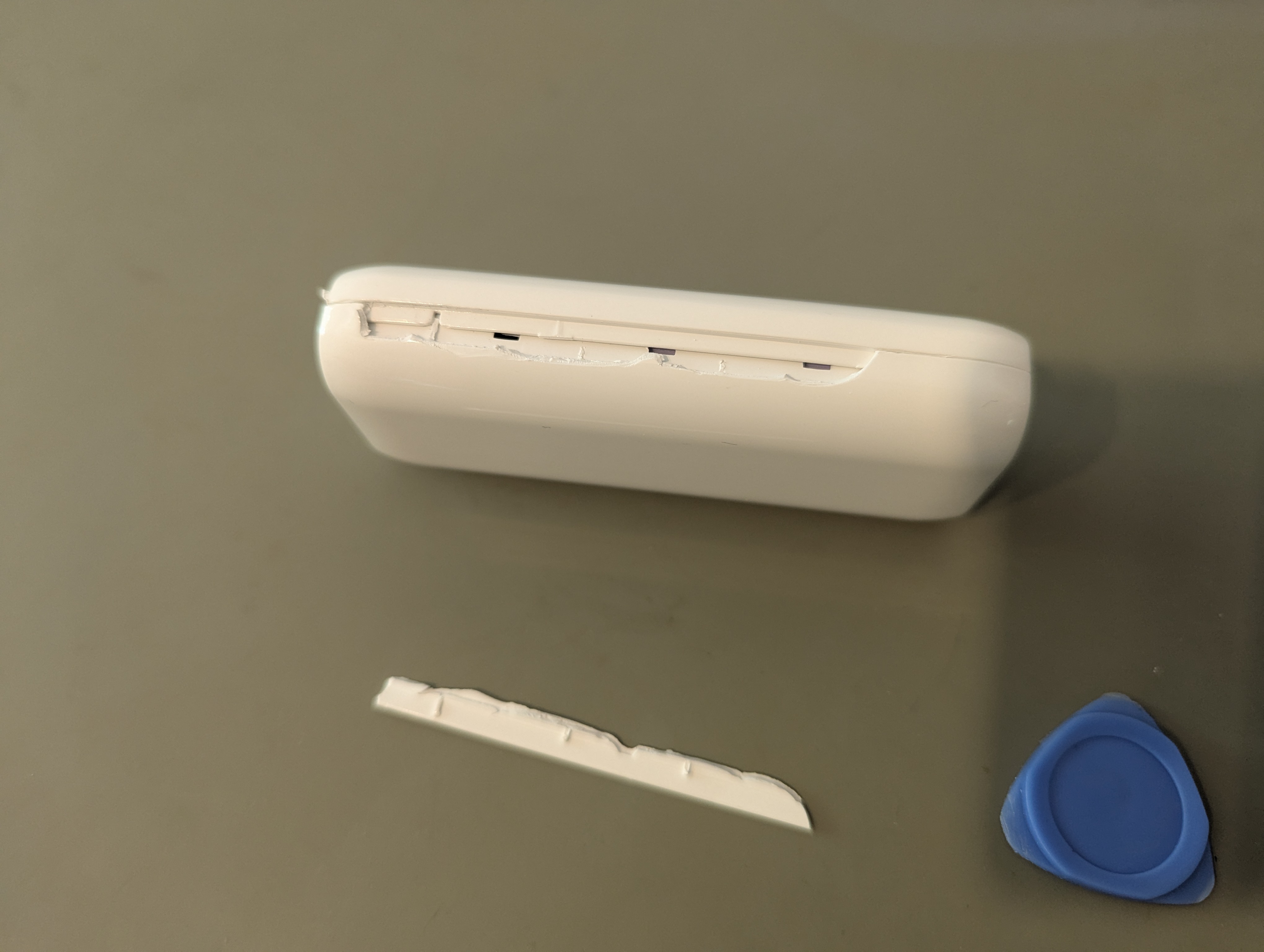 Broken tab off the edge of the device